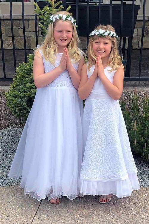 Two girls in party dresses